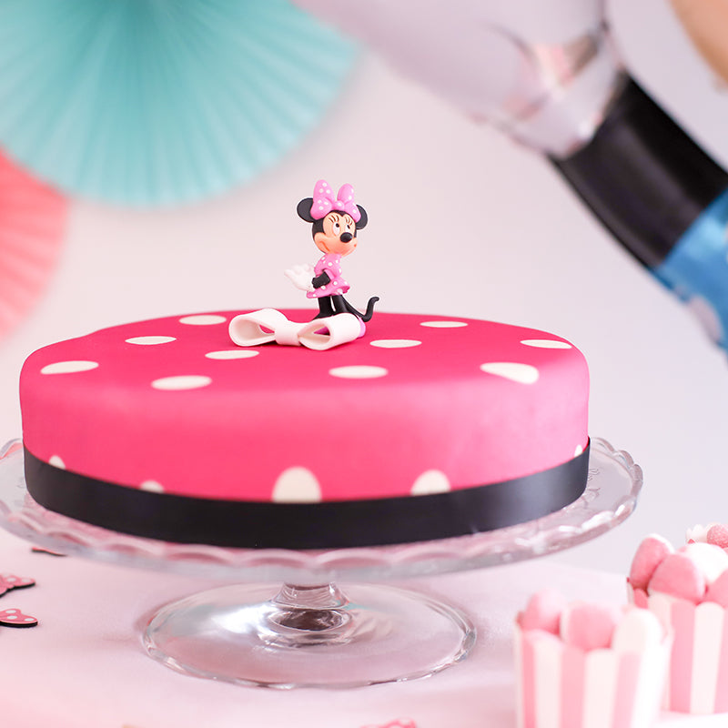 Minnie® sur gâteau rose à pois