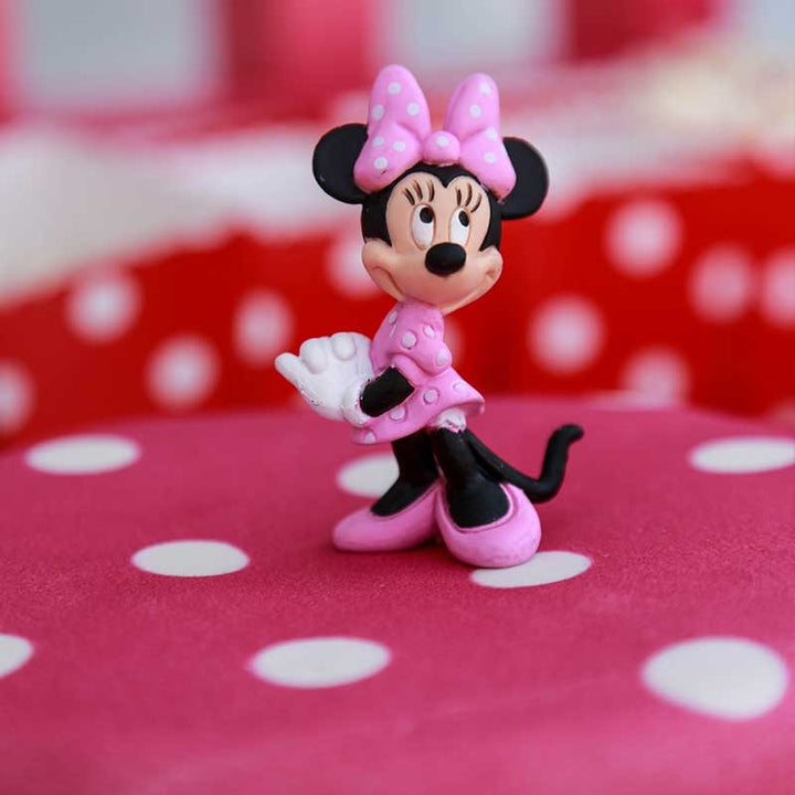 Minnie® sur gâteau rose à pois