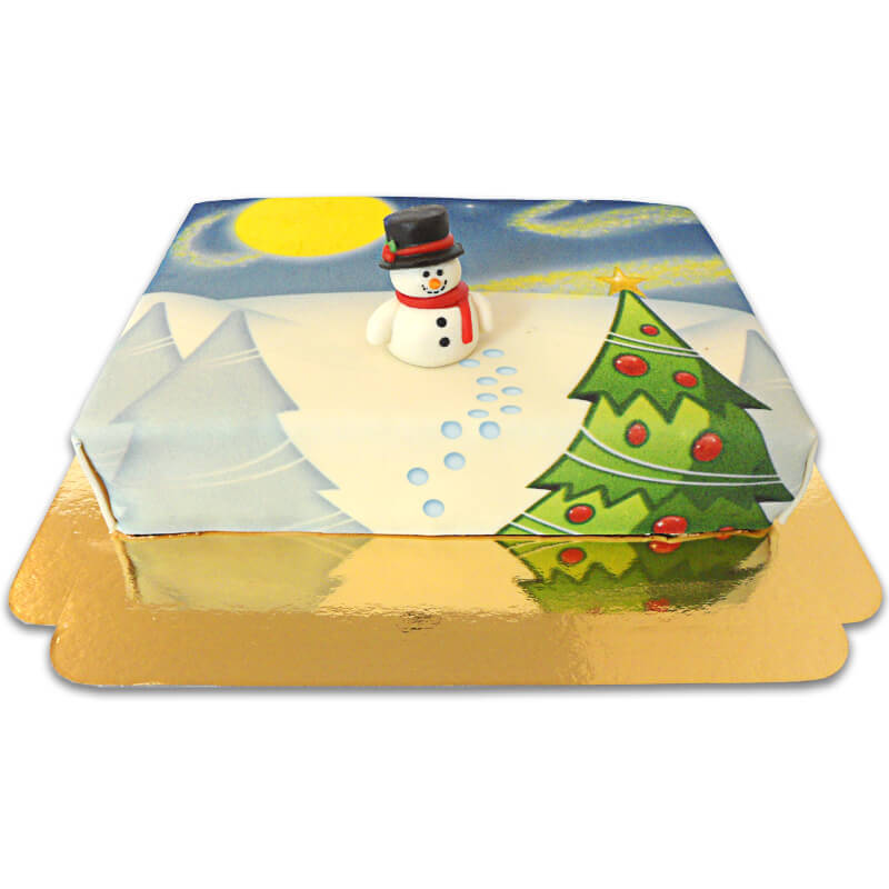 Gâteau paysage enneigé avec figurine bonhomme de neige